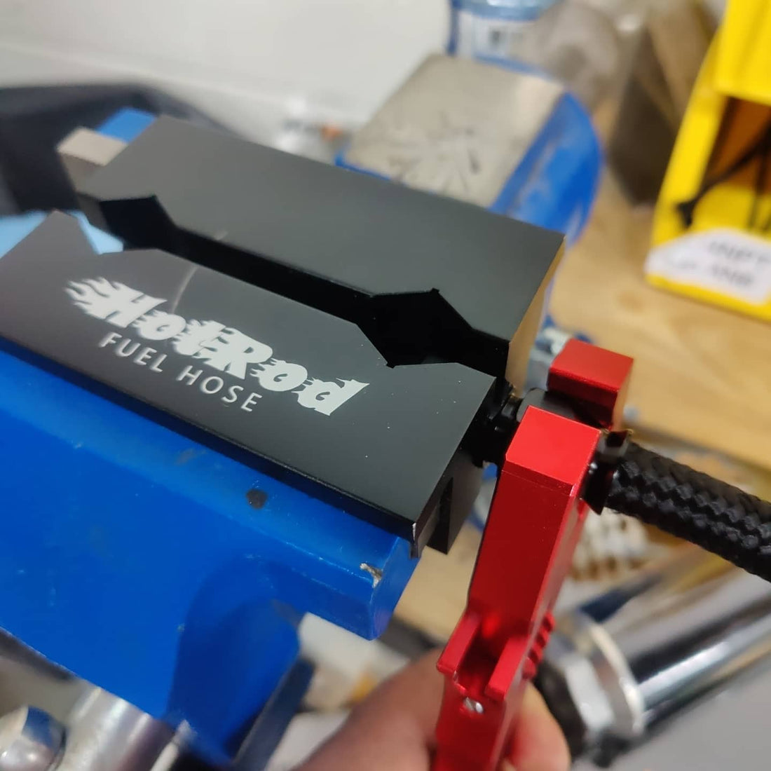 PTFE fitting in vice jaw with wrench for install